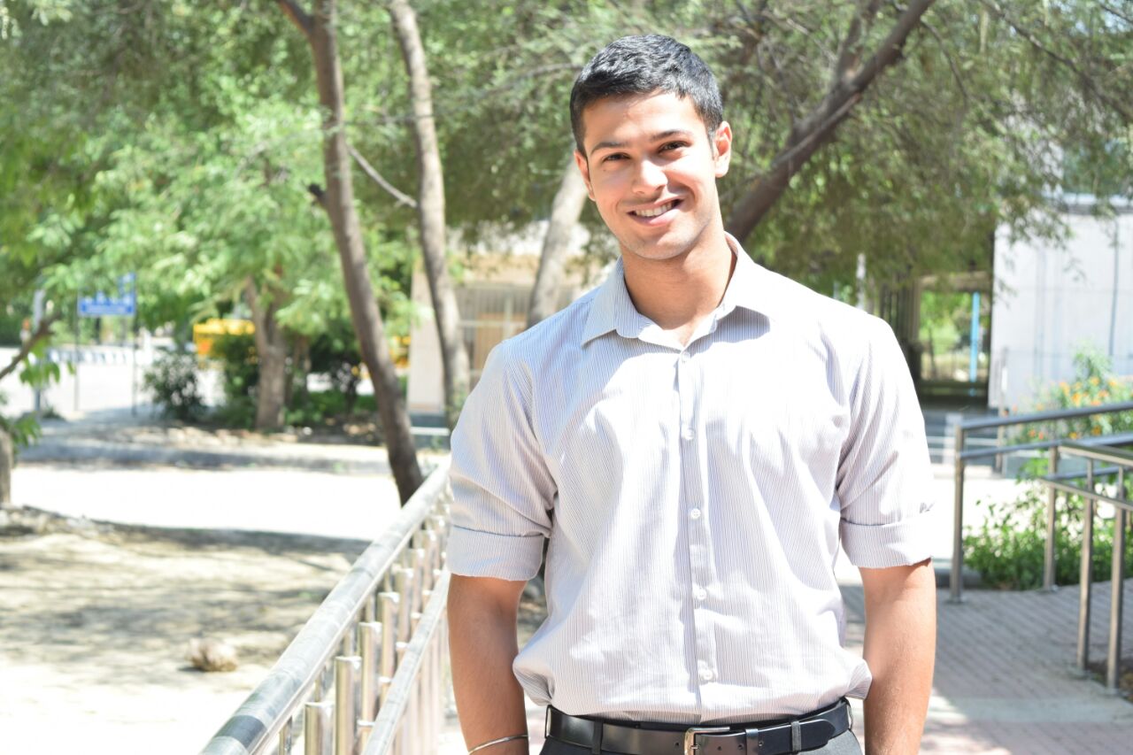 Portrait of Sartaj Singh Dhatt outdoors, smiling